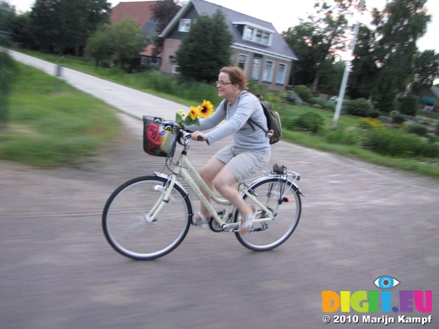 SX15536 Jenni riding her bike back to the campervan